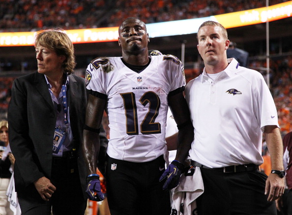 DENVER, CO - SEPTEMBER 5: Jacoby Jones #12 of the Baltimore Ravens walks off of the field after colliding with his own teammate and injuring himself in the second quarter against the Denver Broncos during the game at Sports Authority Field at Mile High on September 5, 2013 in Denver Colorado. (Photo by Doug Pensinger/Getty Images)