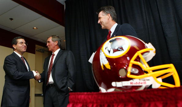 ASHBURN, VA - JANUARY 06: Mike Shanahan (C) shakes hands with Washington Redskins owner Daniel Snyder (L) as General Manager Bruce Allen (R) looks on before Shanahan was announced as the new head coach of the Washington Redskins on January 6, 2010 in Ashburn, Virginia. Shanahan replaces former head coach Jim Zorn who was released January 4 following a 4-12 season. (Photo by Win McNamee/Getty Images)