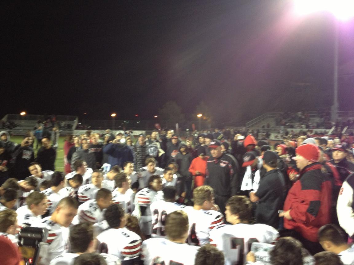Head Coach Mike Herrington addresses his players on the field after defeating Valencia 28-21. (credit: Mike Morgan)