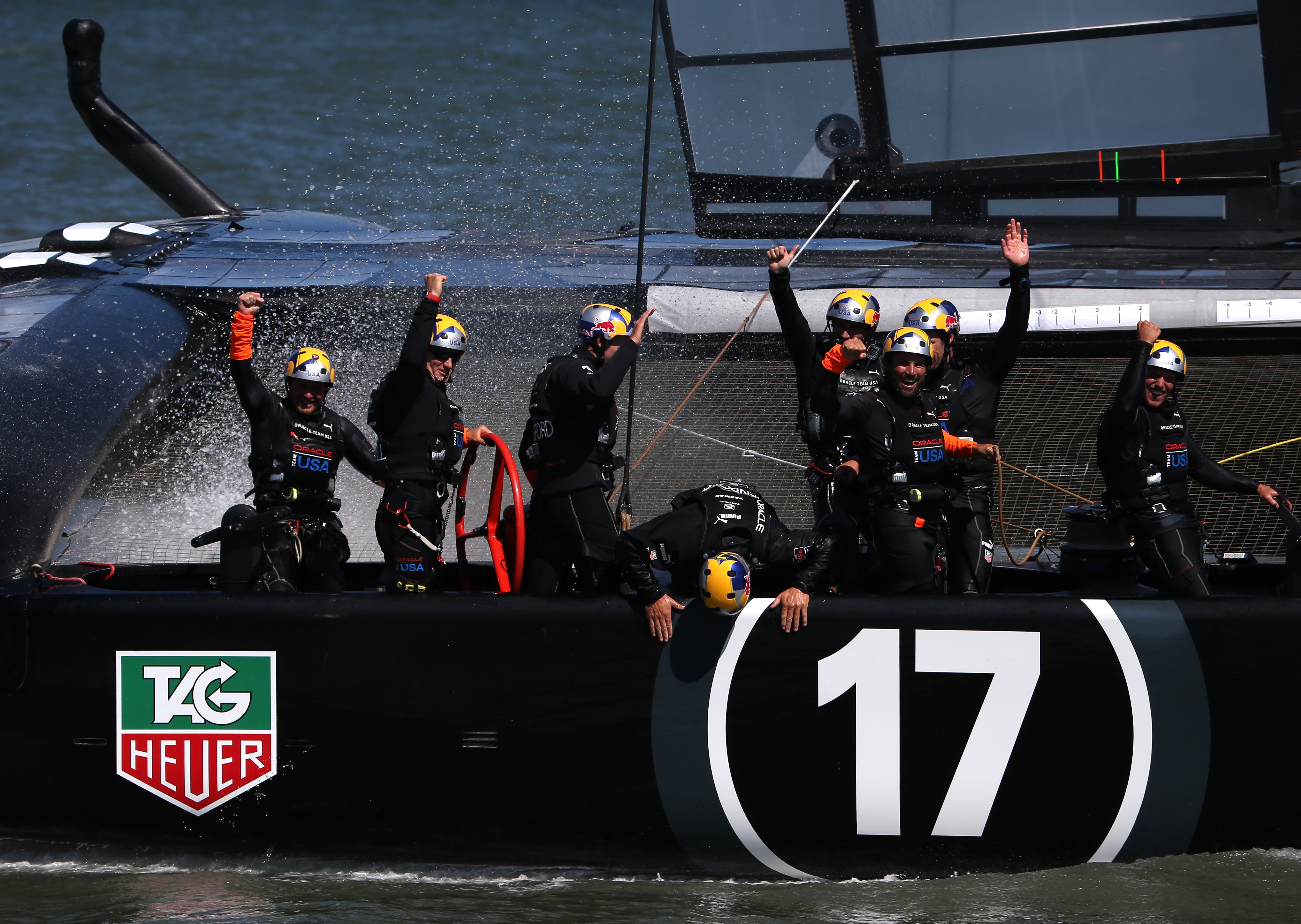 Oracle Team USA skippered by James Spithill celebrates after defending the cup as they beat Emirates Team New Zealand to defend the America's Cup during the final race on September 25, 2013 in San Francisco, California. (credit: Justin Sullivan/Getty Images)