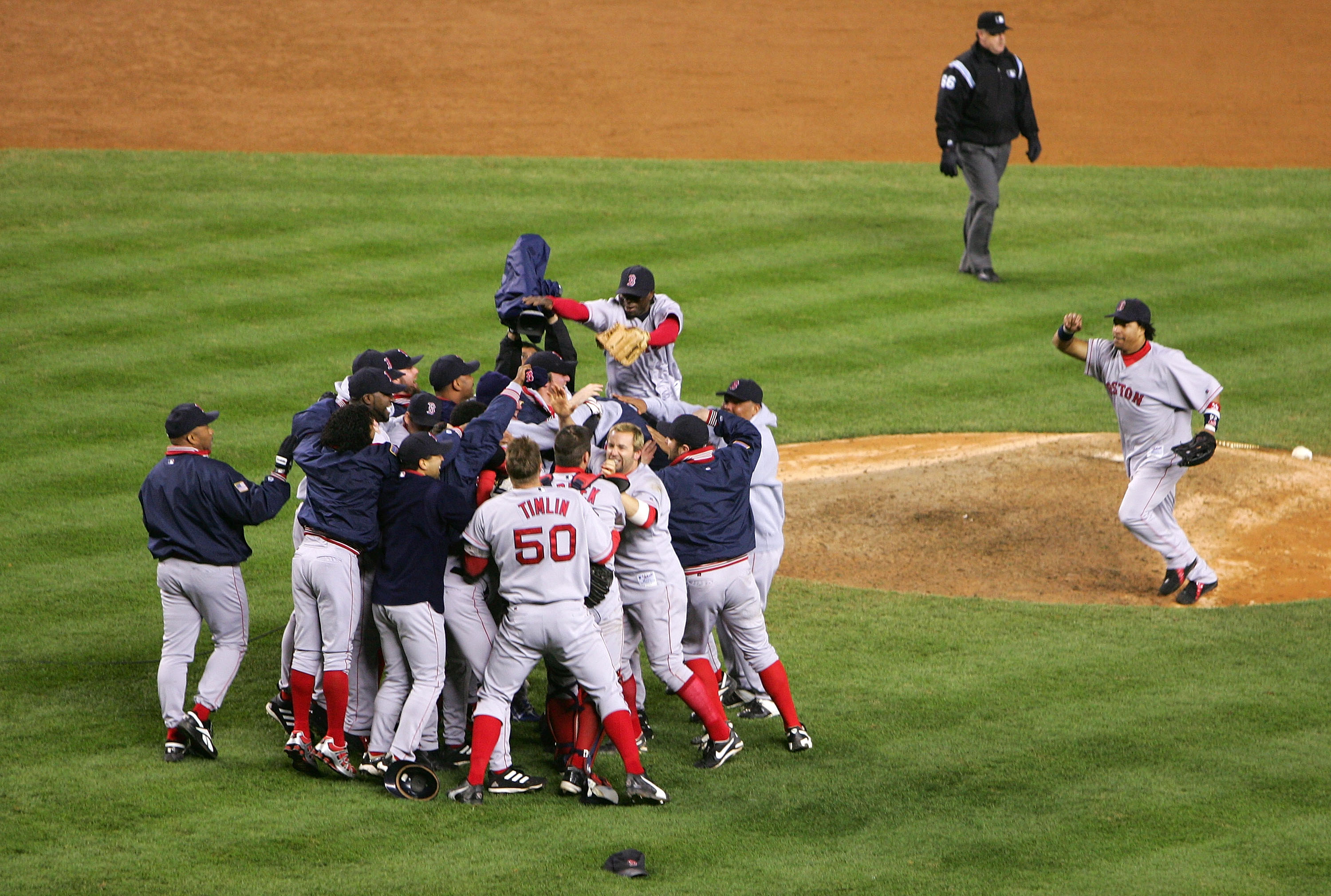  The Boston Red Sox celebrate after defeating the New York Yankees 10-3 to win game seven of the American League Championship Series on October 20, 2004 at Yankee Stadium in the Bronx borough of New York City. (credit: Ezra Shaw/Getty Images)