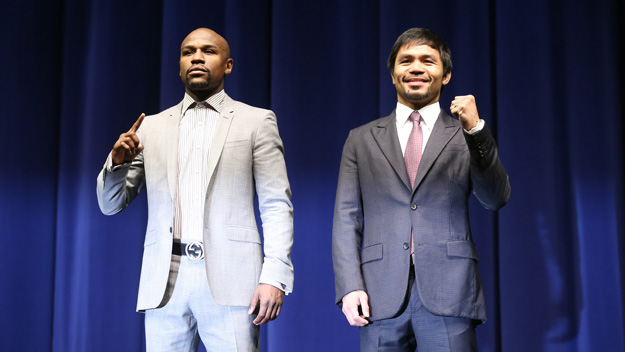 Floyd Mayweather (L) and Manny Pacquiao pose together at the end of their Press Conference promoting their upcoming fight.