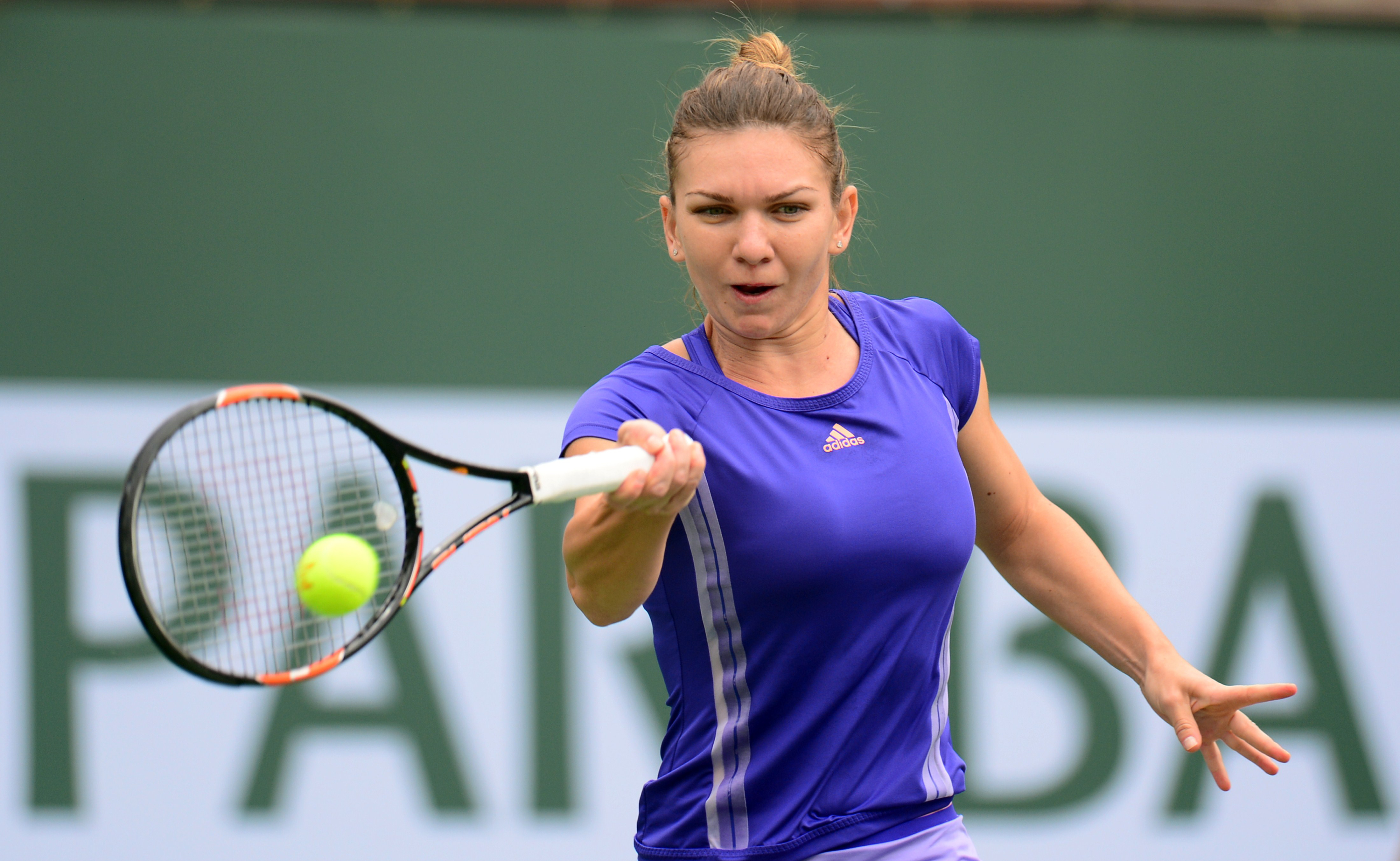 Simona Halep hits a forehand return to Jelena Jankovic during the women's final of the BNP Paribas Open In Indian Wells on Sunday. (credit: Frederic J. Brown/AFP/Getty Images)