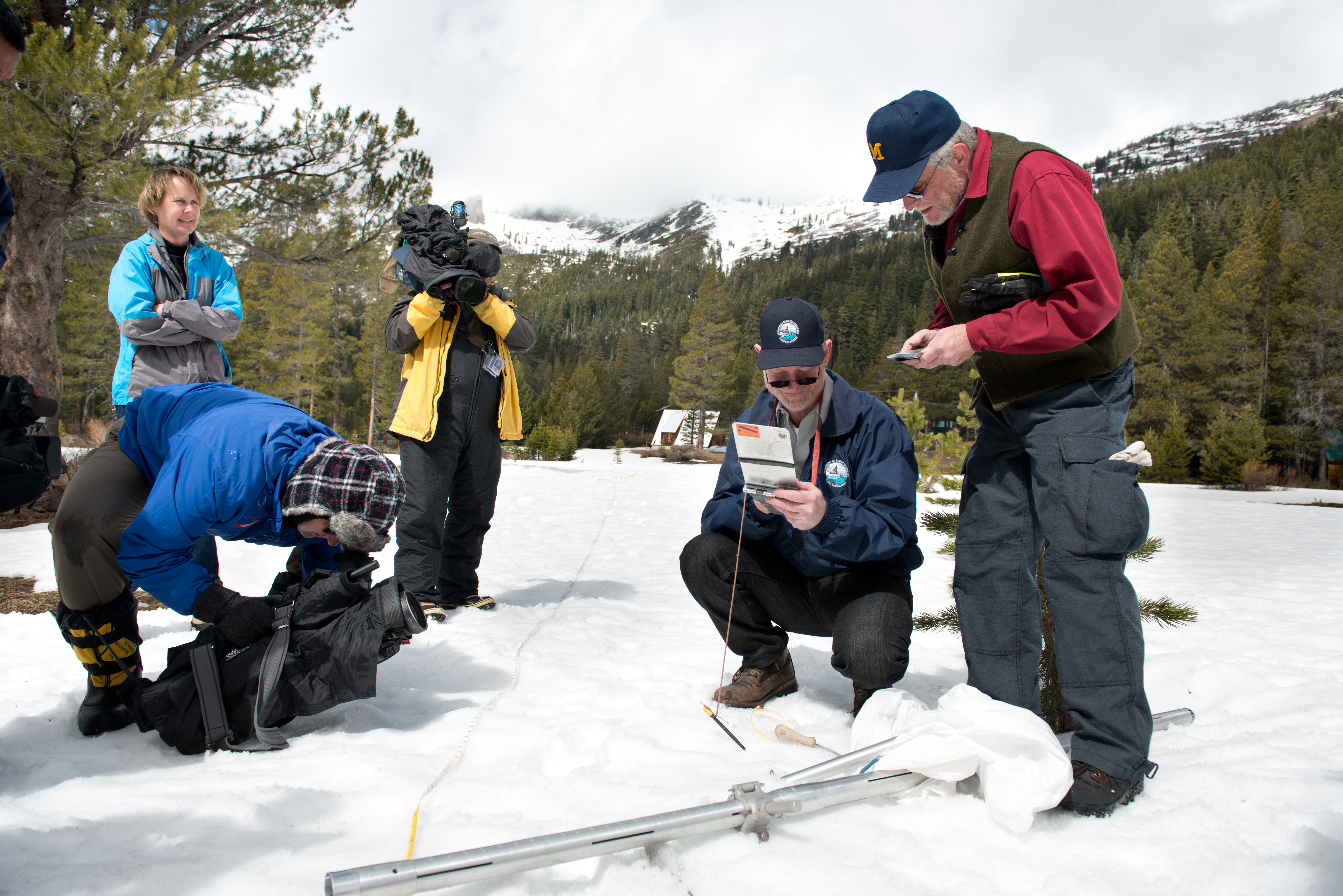This photo from March 2013 shows Keith Swanson (DWR Chief of Division of Flood Management) and Frank Gehrke (DWR Chief of Snow Surveys) conduct the annual snow survey at Phillips Station. This year, the location had no visible snow covering the ground. (Photo courtesy Gov. Jerry Brown's Office)