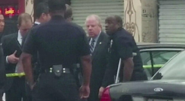 Authorities identified L.A. police officer Clifford Proctor - pictured here on crutches - as the officer involved in the May 5 shooting. (credit: CBS) 