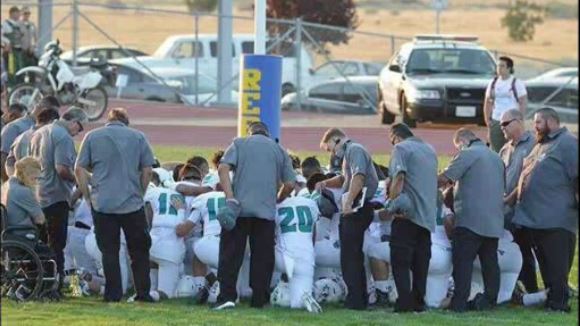 Members of the Sultana High School football team prayed for their teammate, Bruce Henderson, who suffered a severe head injury Friday night during a game.