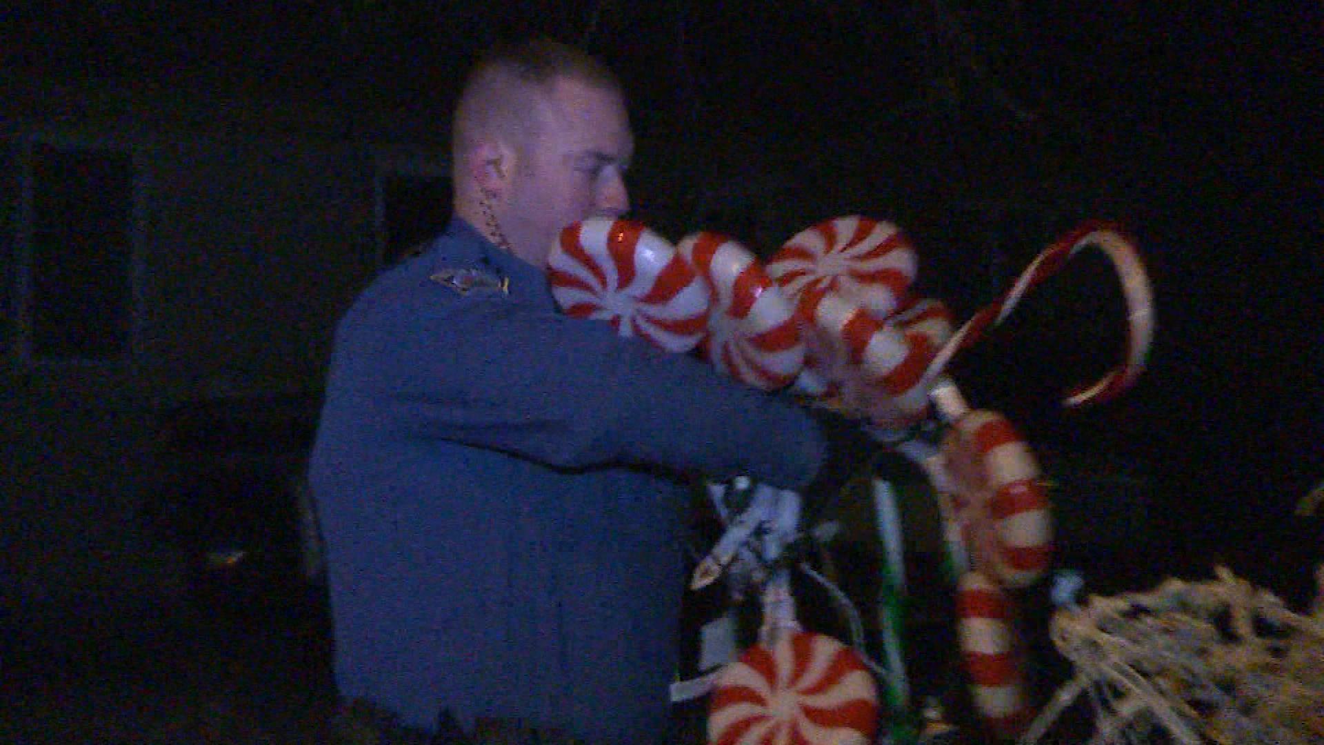 Law enforcement removes some of the decorations. (credit: KKTV)