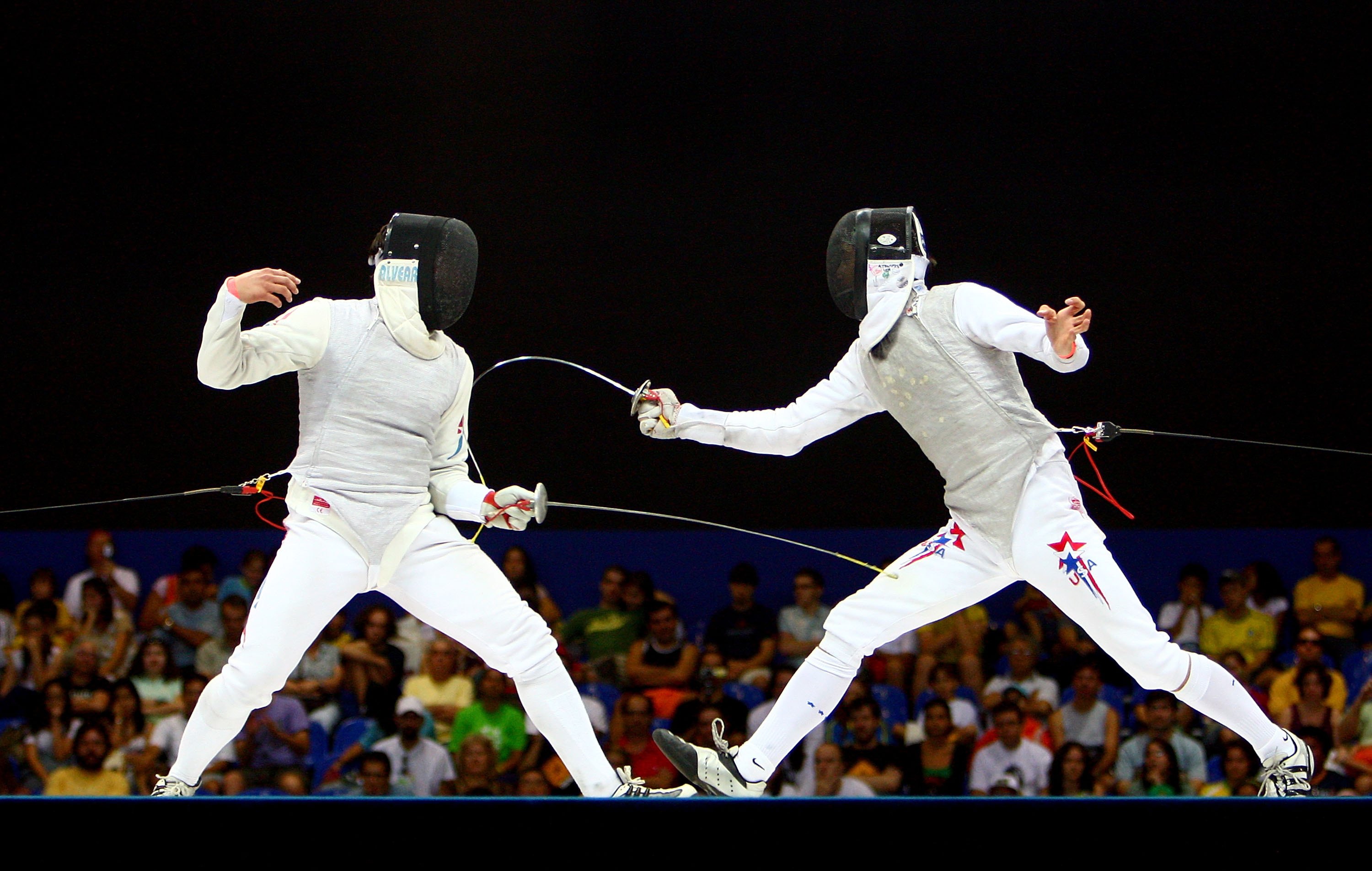 Andras Horanyi of the United States of America (R) and Felipe Alvear of Chile compete in the Men's Individual Foil final during the XV Pan American Games on July 14, 2007 at Copacabana Beach in Rio De Janeiro, Brazil.  (Photo by Donald Miralle/Getty Images)