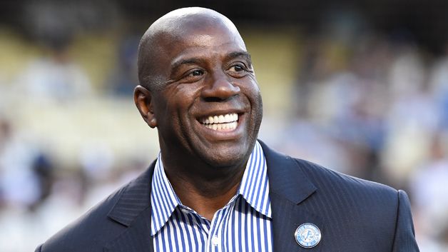 Magic Johnson attends a ceremony honoring Jackie Robinson before the game between the San Francisco Giants and the Los Angeles Dodgers at Dodger Stadium on April 15, 2016 in Los Angeles, California. All players are wearing #42 in honor of Jackie Robinson Day.