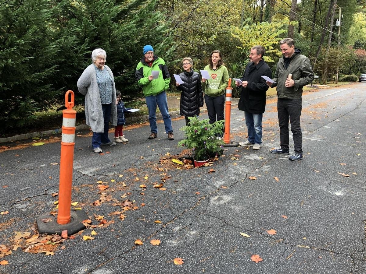 Neighbors Fed Up With Growing Pothole Fill It With Christmas Tree