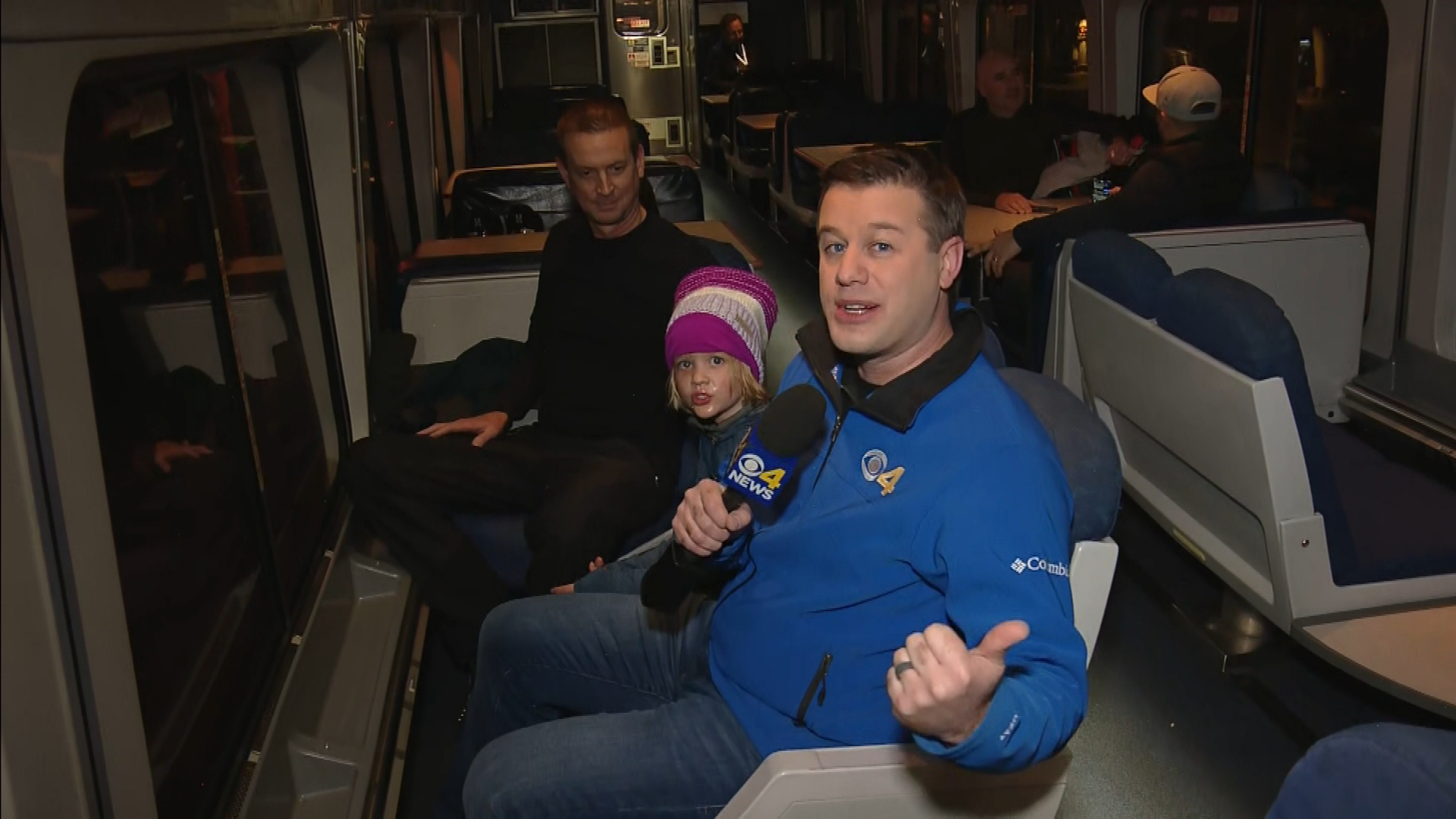 CBS4's Ashton Altieri interviews a family on the ski train on Friday morning.