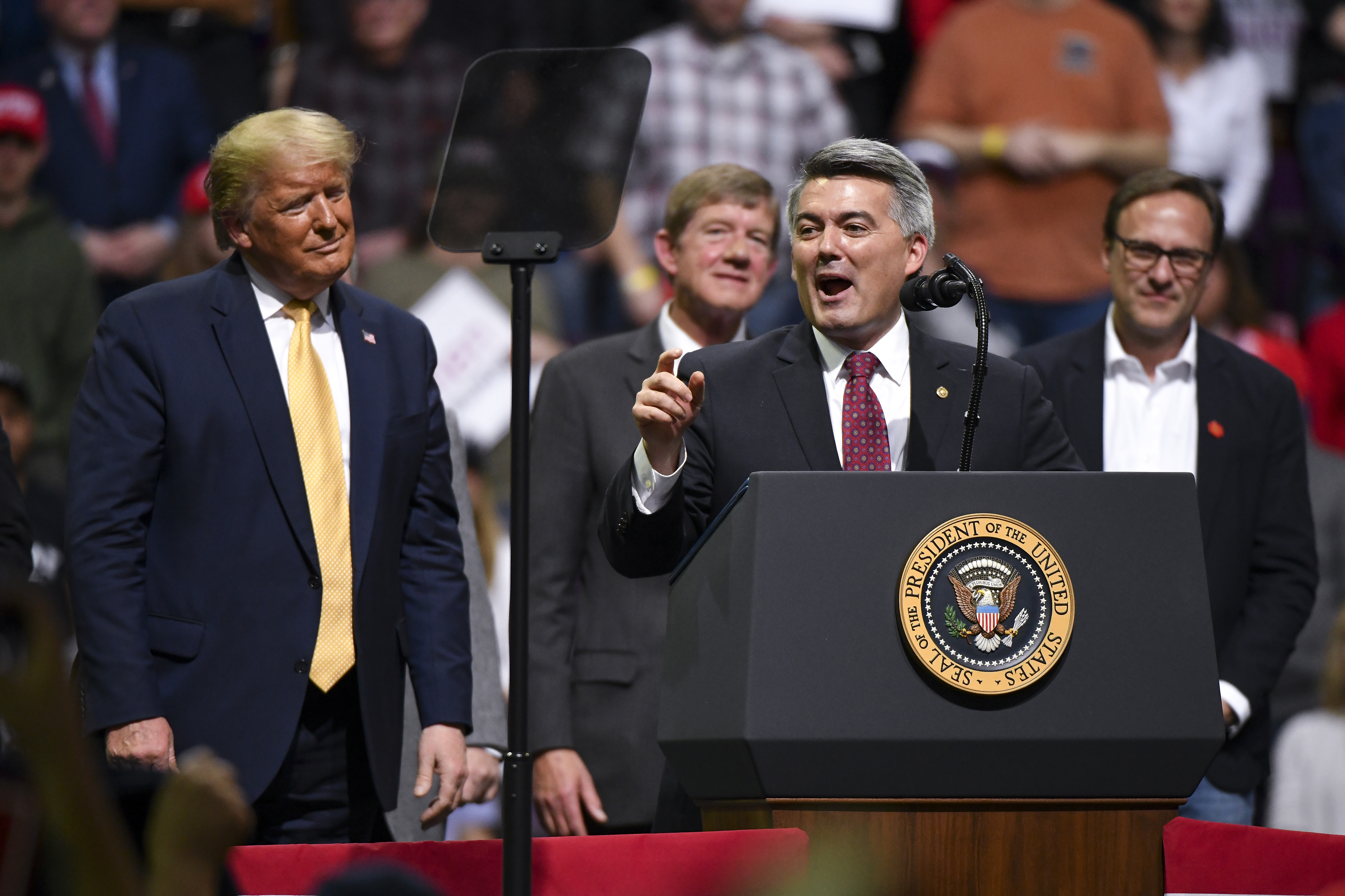Sen. Cory Gardner speaks with President Donald Trump on stage during a Keep America Great rally on Feb. 20, 2020, in Colorado Springs.