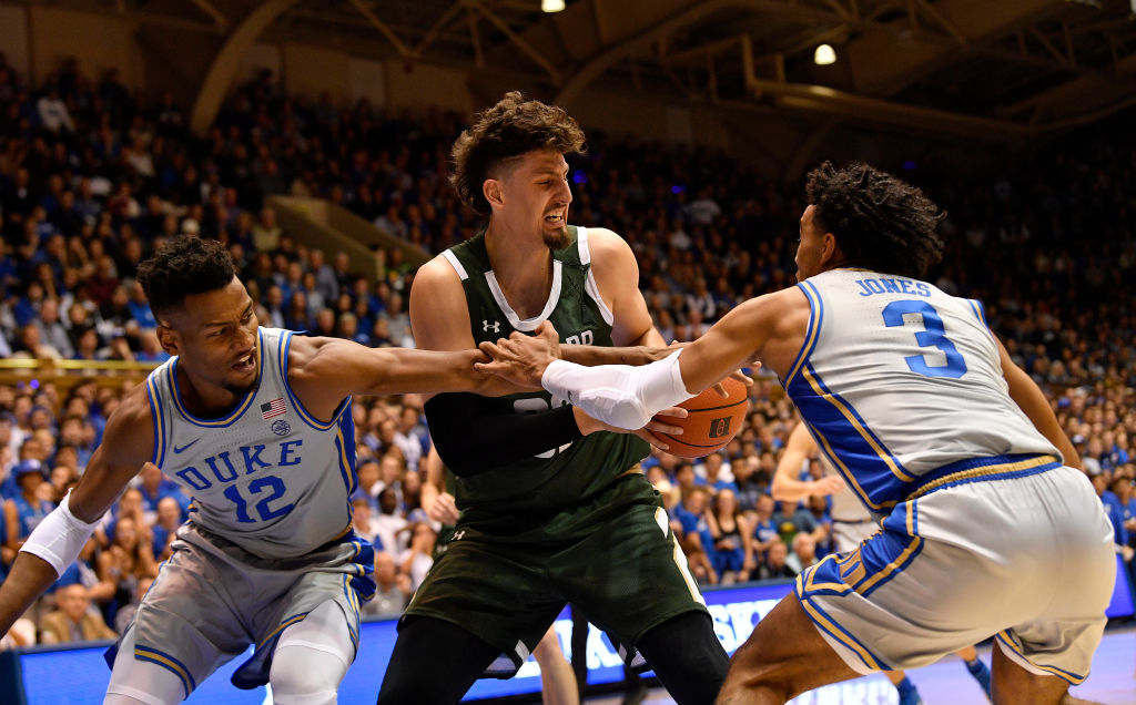 Javin DeLaurier #12 and Tre Jones #3 of the Duke Blue Devils defend Nico Carvacho of the Colorado State Rams at Cameron Indoor Stadium on Nov. 8, 2019 in Durham, North Carolina.