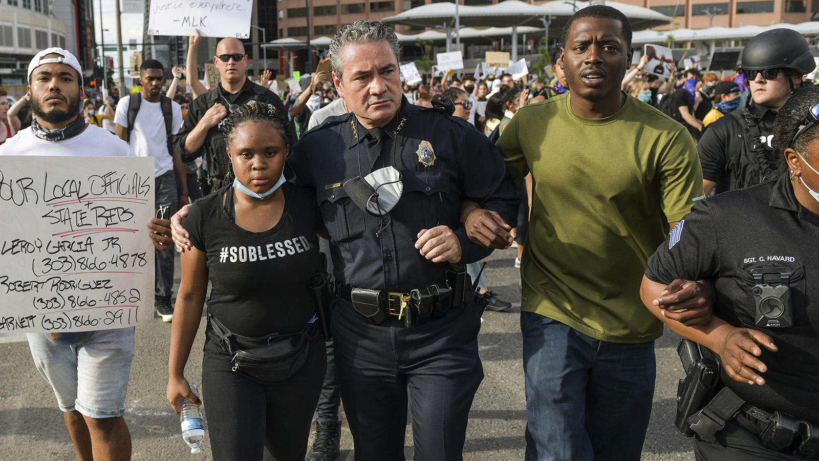 Denver Police Chief Paul Pazen embraces a woman during a march to protest the death of George Floyd on June 1, 2020 in Denver.