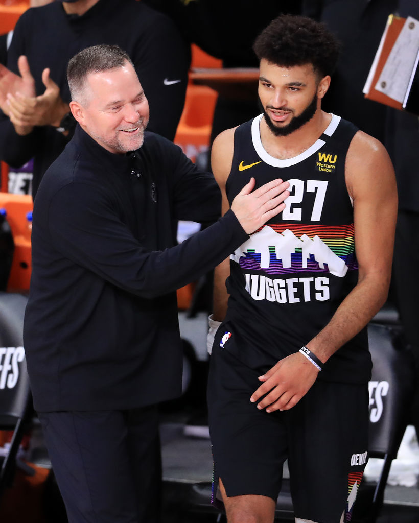 Michael Malone of the Denver Nuggets congratulates Jamal Murray during the fourth quarter in Game 6.