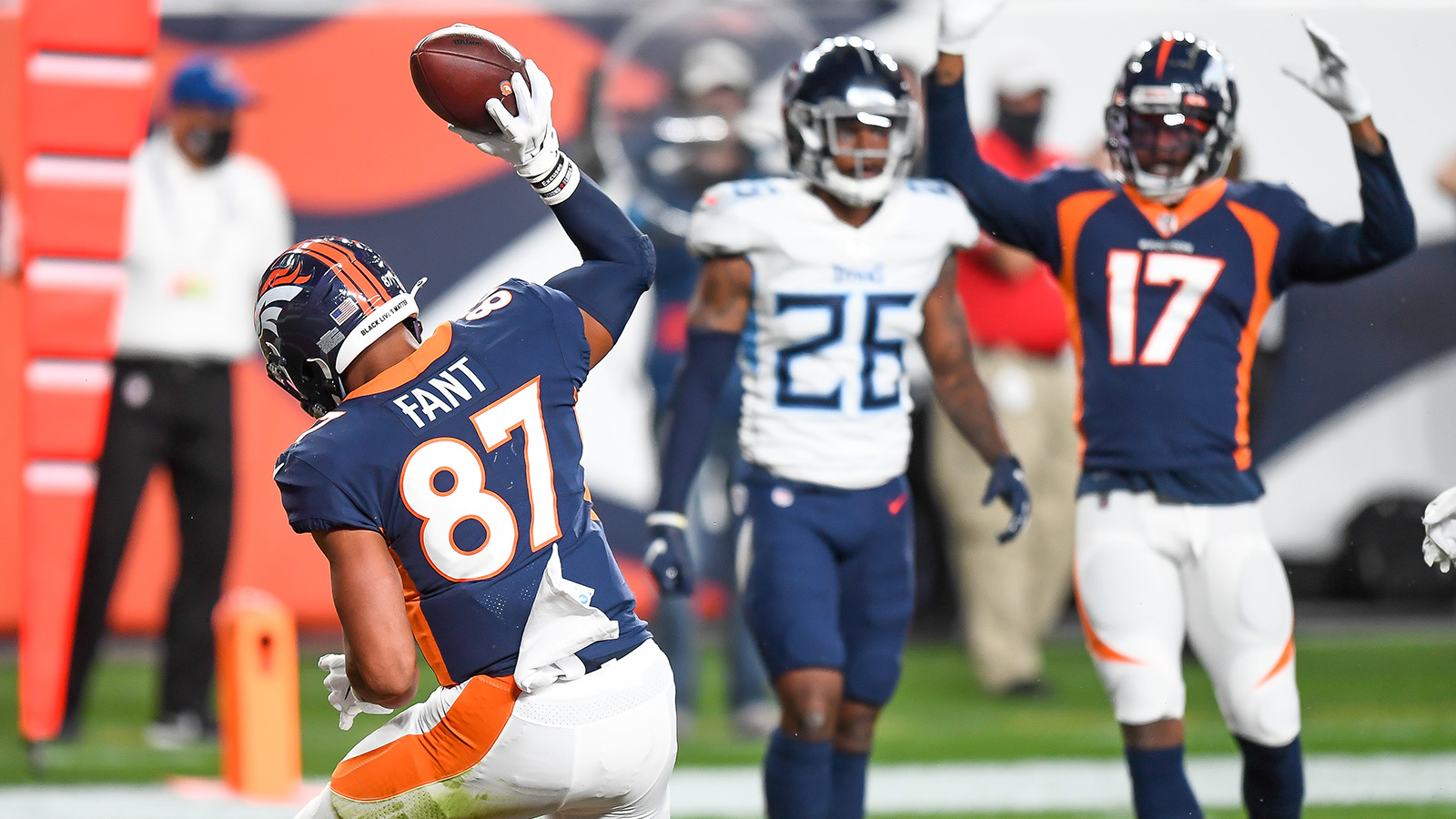 Noah Fant of the Denver Broncos celebrates after a first quarter touchdown reception against the Tennessee Titans at Empower Field at Mile High.