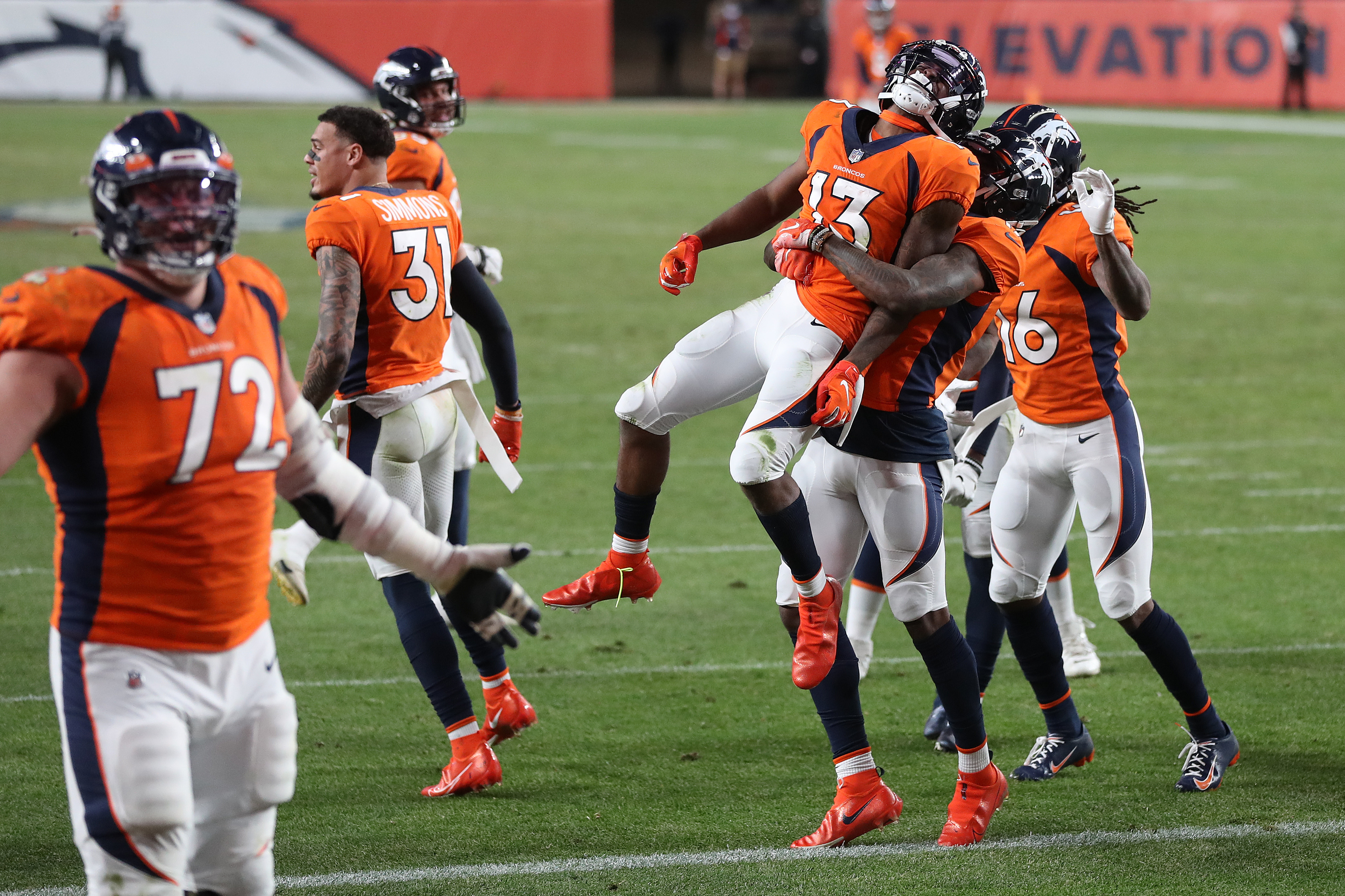 KJ Hamler #13 of the Denver Broncos celebrates with teammates after scoring a touchdown against the Los Angeles Chargers at the end of the fourth quarter of the game at Empower Field At Mile High on November 01, 2020 in Denver, Colorado. The Denver Broncos won 31-30.