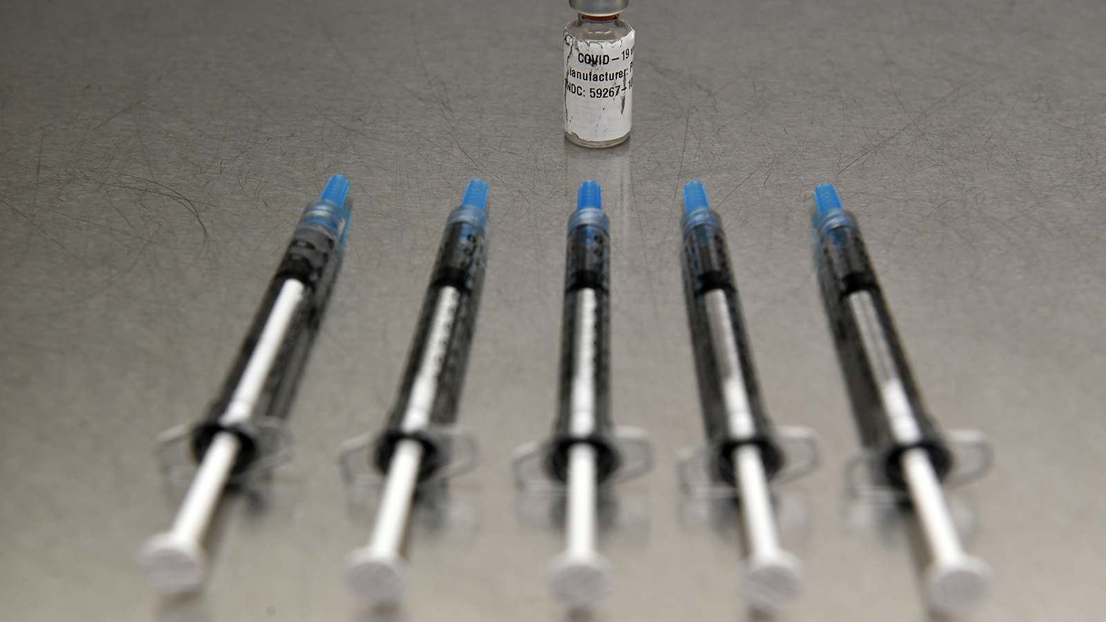 From one vial of the mock Covid-19 vaccines pharmacists will reconstitute the vaccine to create five doses per vial at Vail Health Hospital on December 8, 2020.