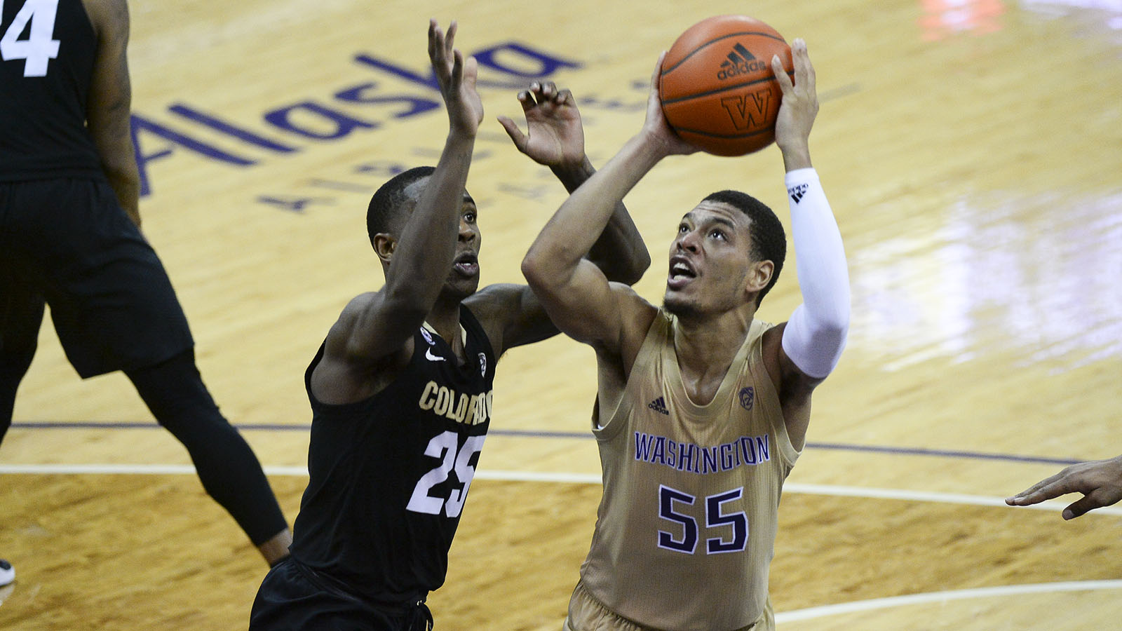 Colorado Buffaloes guard McKinley Wright IV defends against Washington Huskies guard Quade Green during a Pac-12 conference college basketball game between the Colorado Buffaloes and the Washington Huskies on Jan. 20, 2021, at Hec Edmundson Pavilion in Seattle.