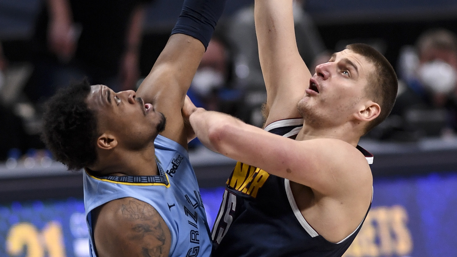 Nikola Jokic of the Denver Nuggets scores over Xavier Tillman of the Memphis Grizzlies during the second overtime at Ball Arena on April 19, 2021.