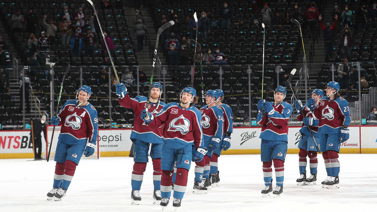 Members of the Colorado Avalanche salute the fans after the 9-3 victory against the Arizona Coyotes on March 31, 2021 in Denver.
