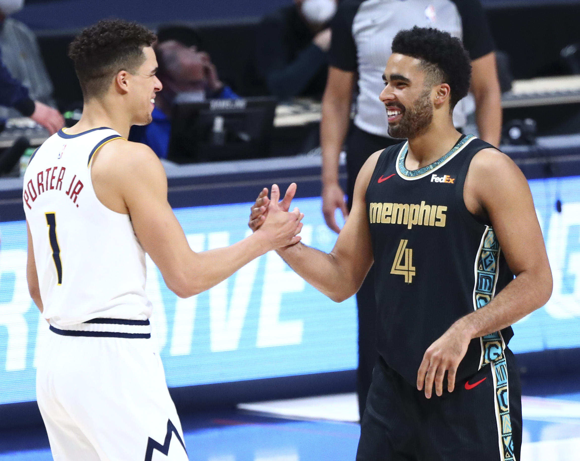 Michael Porter Jr. of the Denver Nuggets and Jontay Porter of the Memphis Grizzlies shake hands after the game at Ball Arena on April 26, 2021.