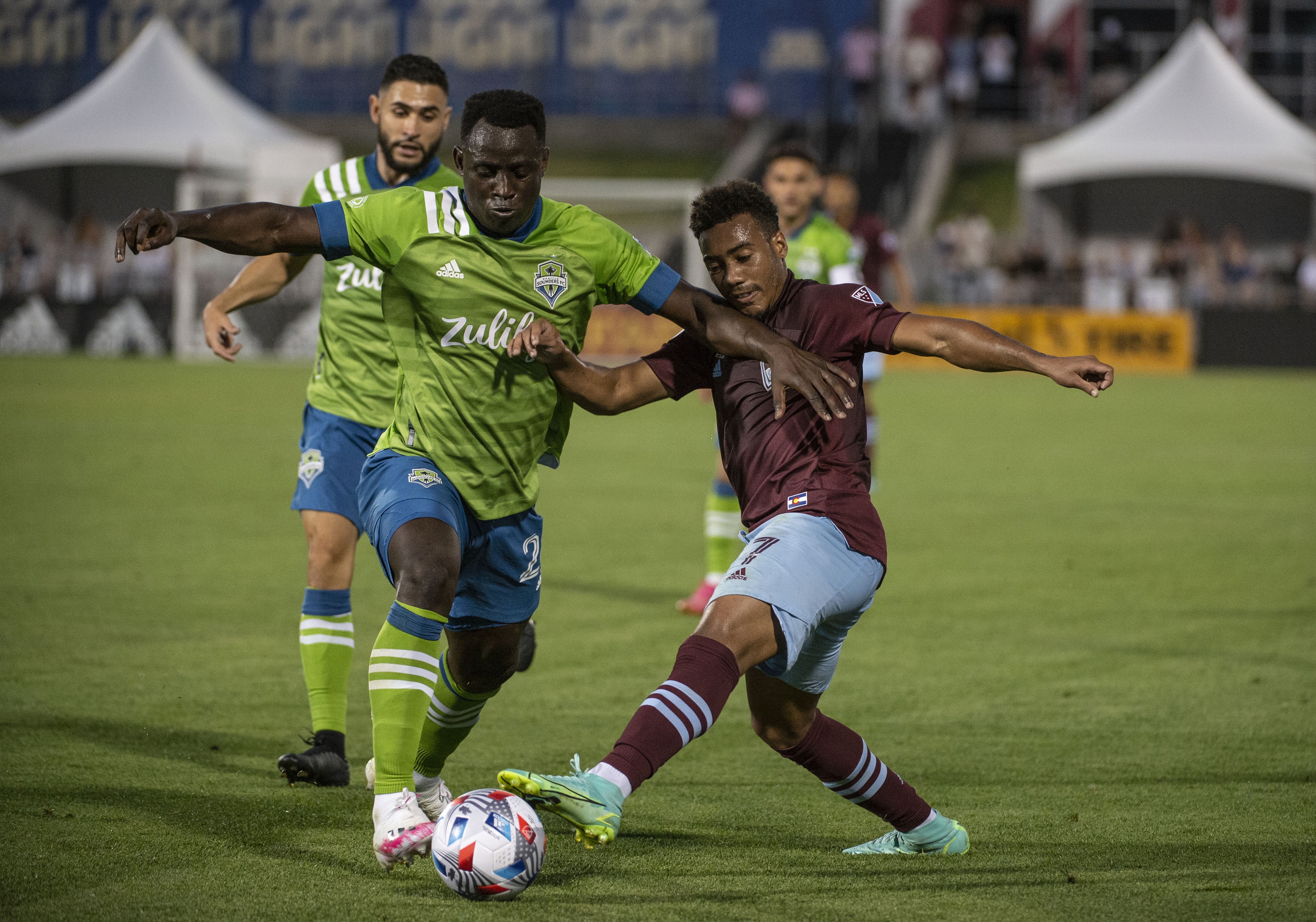 Sounders Defender Yeimar Gomez Andrade (28) and Rapids Forward Jonathan Lewis (7) battle for control during a Major League Soccer match between Seattle Sounders FC and Colorado Rapids on July 4, 2021 at Dick's Sporting Goods Park. 