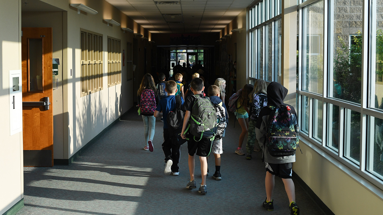 Students head to class at West Ridge Elementary, in the 27J School District, on Aug.12, 2021 in Thornton.