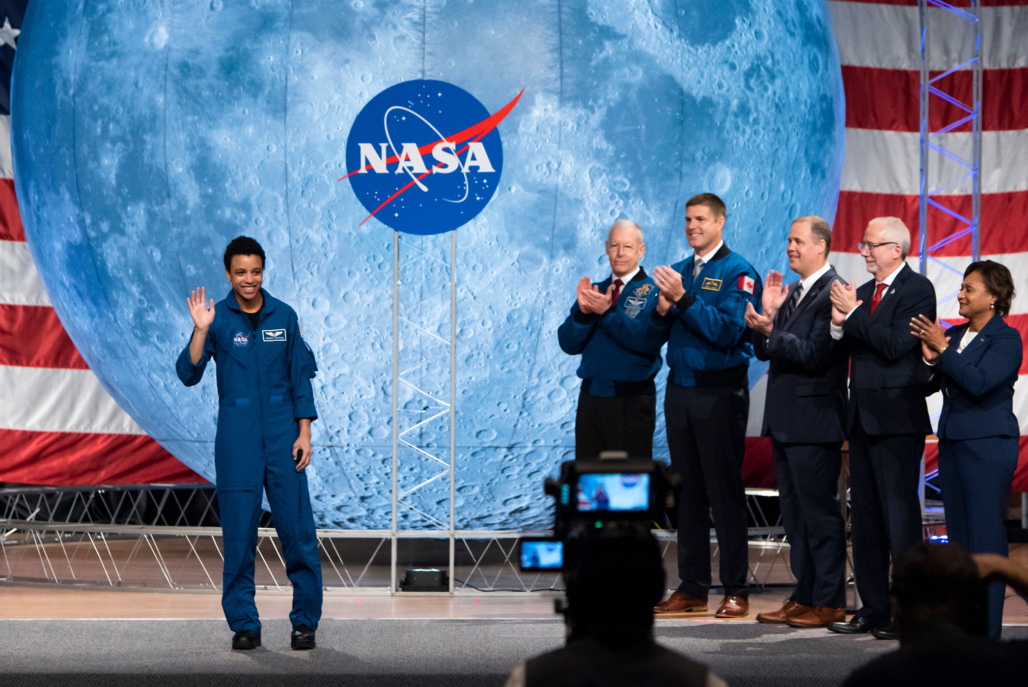 NASA astronaut Jessica Watkins waves at the audience during the astronaut graduation ceremony at Johnson Space Center in Houston Texas, on January 10, 2020.