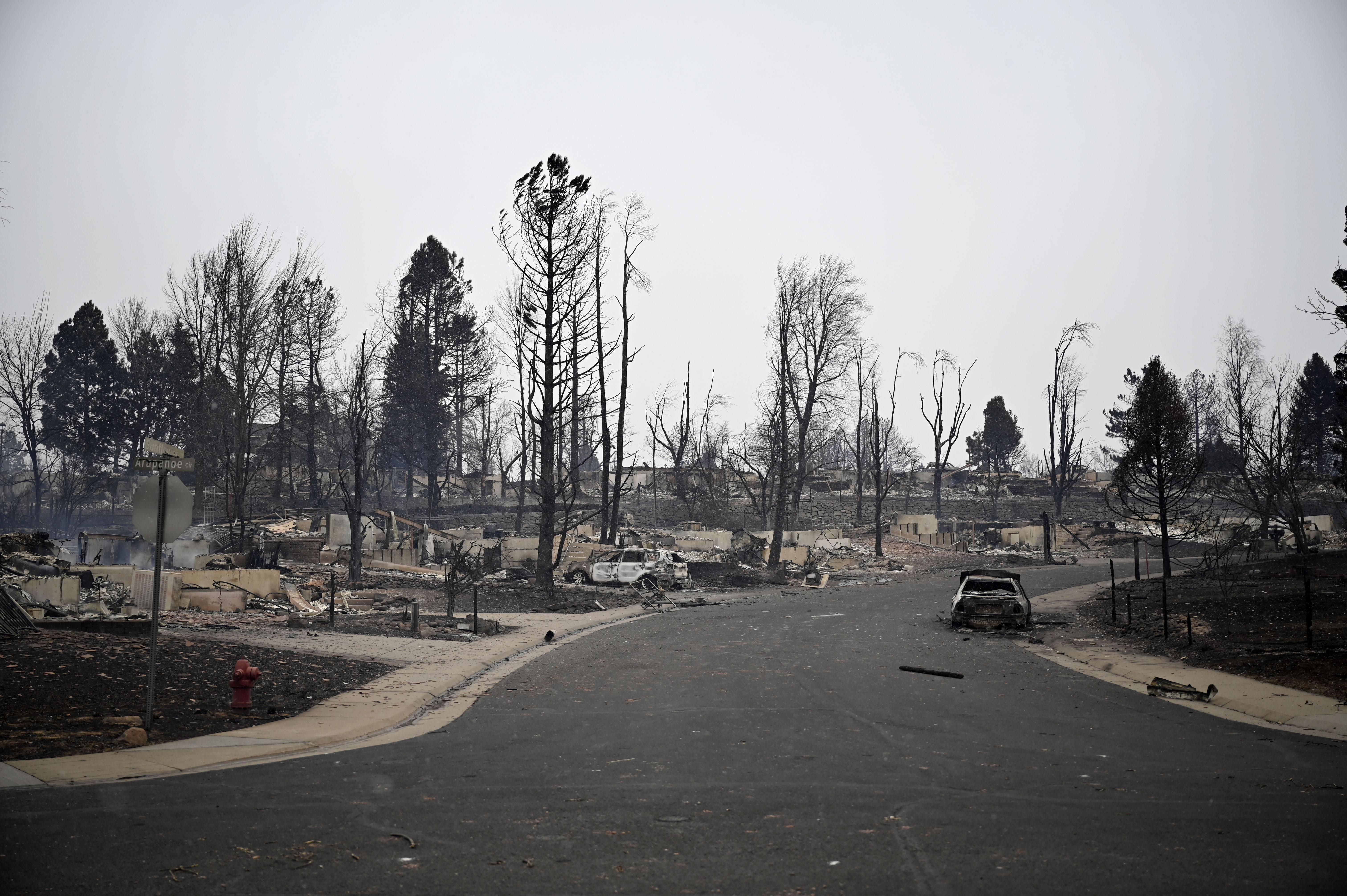 Charred landscape and homes devastated by the Marshall fire in a Louisville subdivision to the south of Harper Lake on Friday, December 31, 2021.