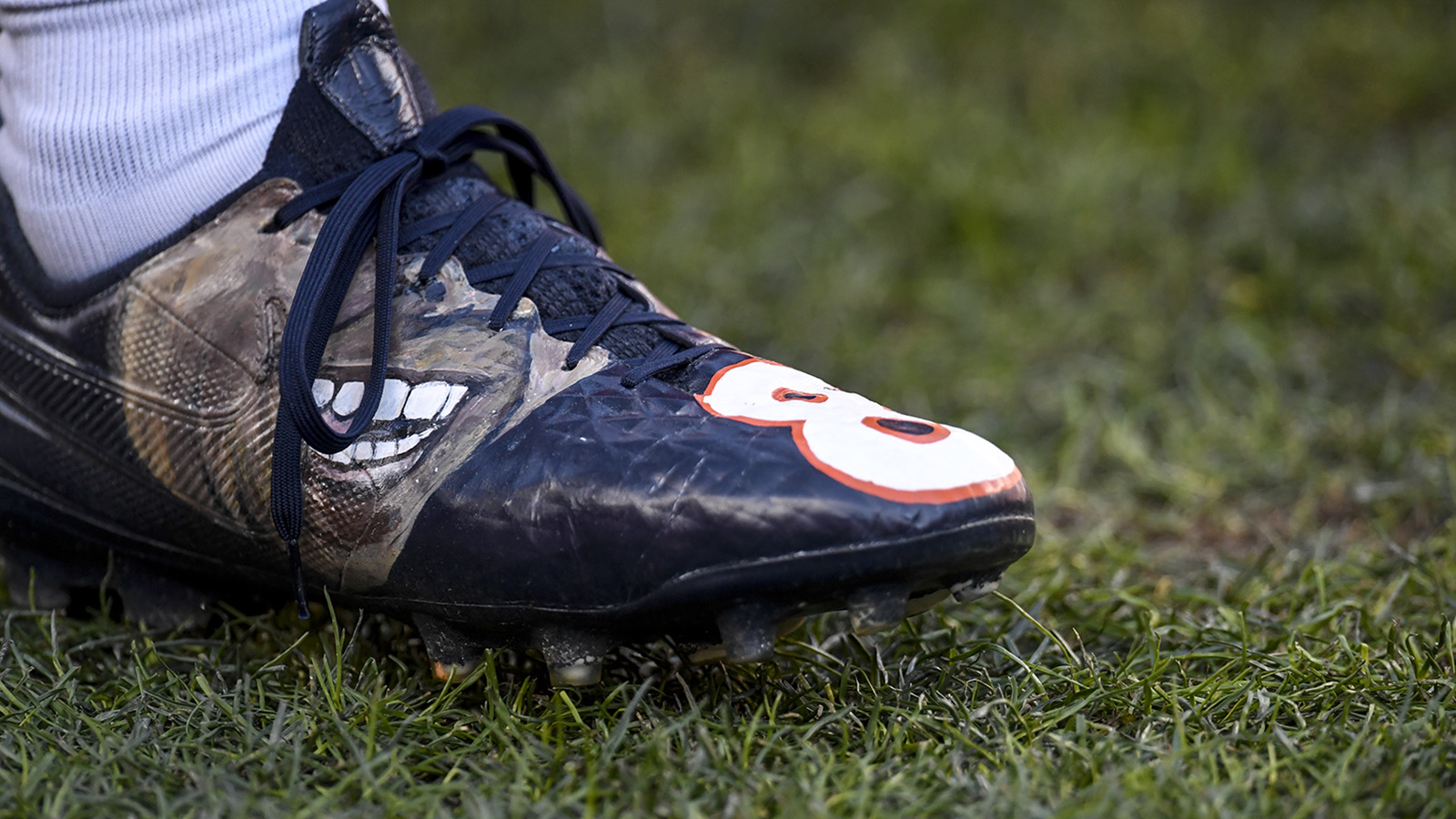 Brandon McManus of the Denver Broncos wears custom shoes honoring the memory of late teammate Demaryius Thomas earlier in the week during the first quarter against the Detroit Lions at Empower Field at Mile High December 12, 2021.