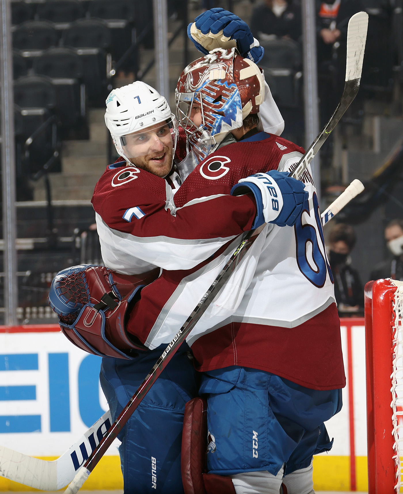 Devon Toews #7 and Justus Annunen #60 of the Colorado Avalanche celebrate after defeating the Philadelphia Flyers 7-5 at the Wells Fargo Center on December 6, 2021 in Philadelphia, Pennsylvania.