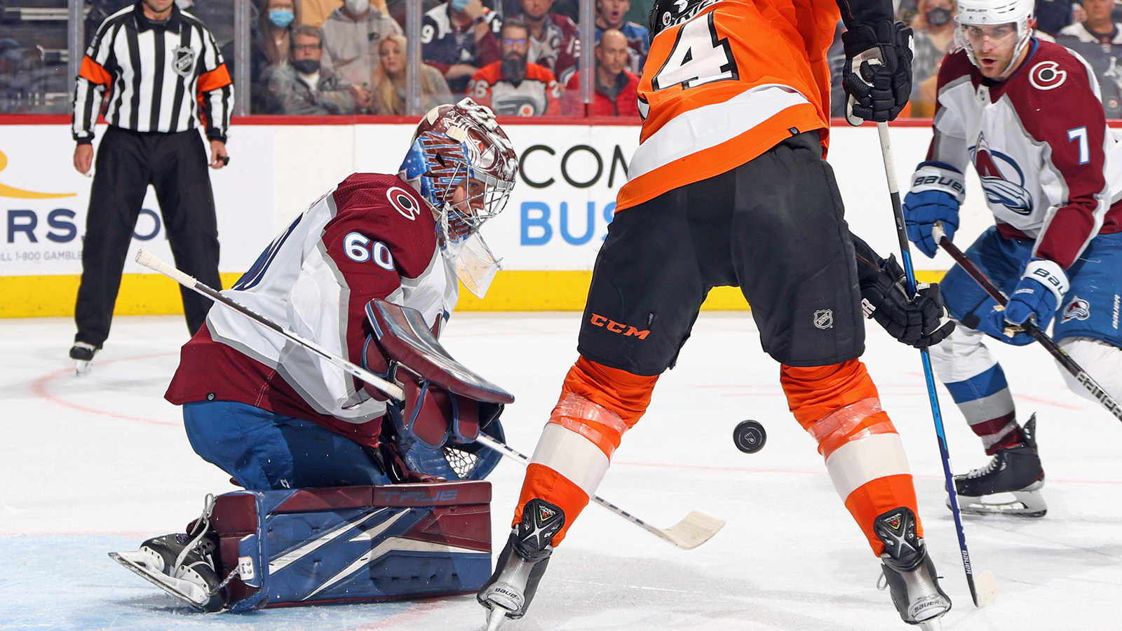 Justus Annunen #60 of the Colorado Avalanche makes the second period save as Sean Couturier #14 of the Philadelphia Flyers looks for the rebound at the Wells Fargo Center on December 6, 2021.