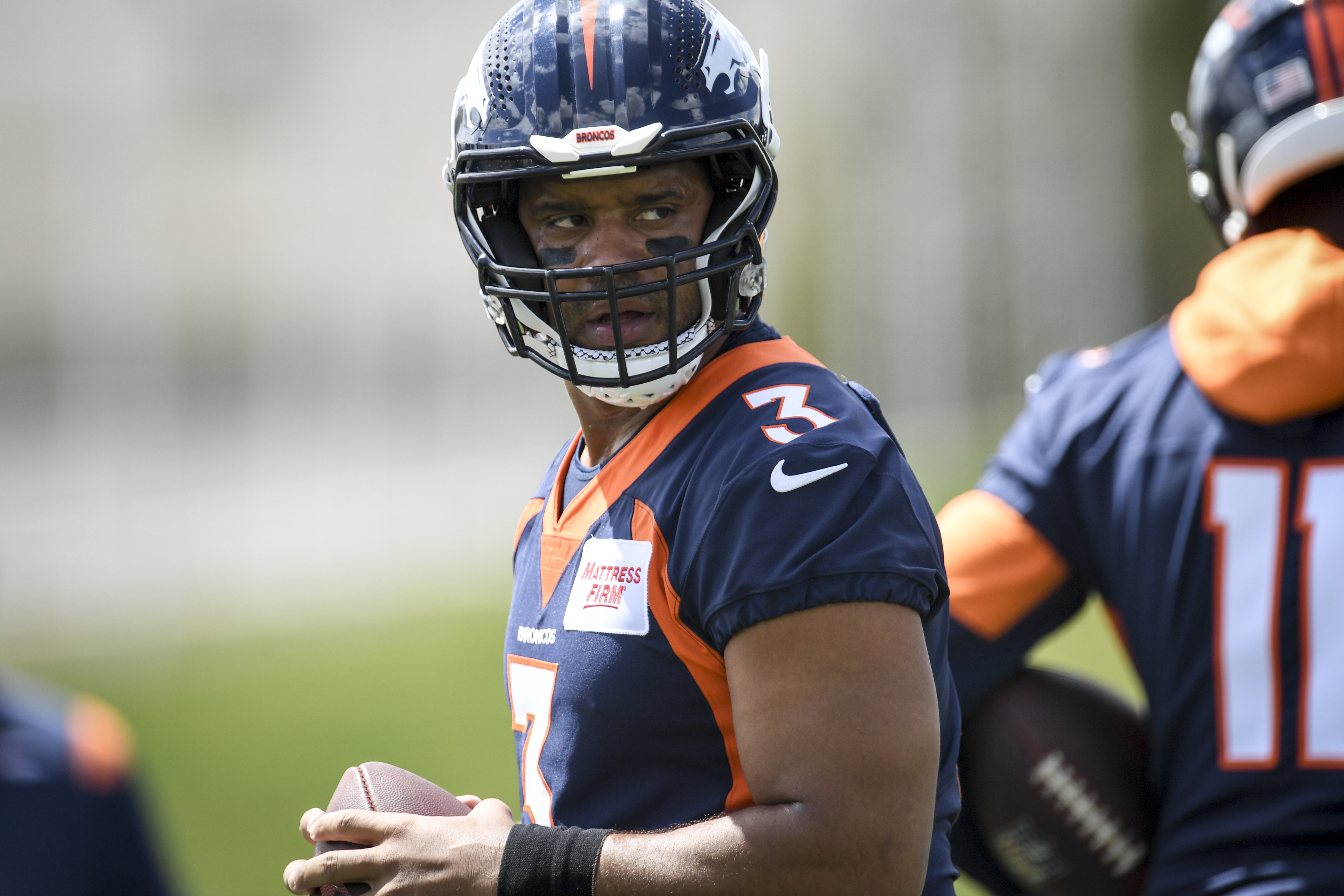Russell Wilson of the Denver Broncos works out during minicamp on April 25, 2022.