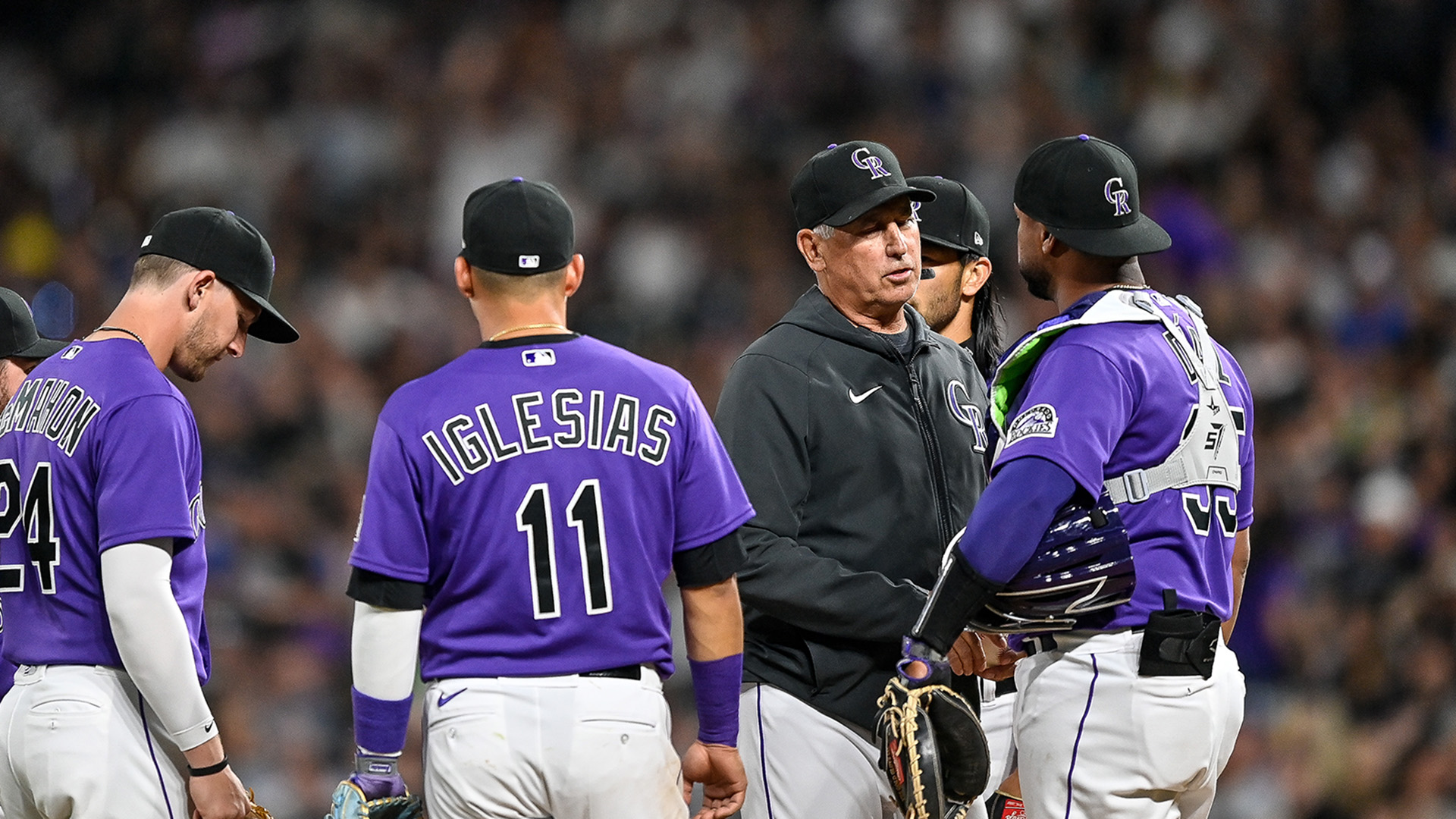 Colorado Rockies manager Bud Black has a word with catcher Elias Diaz during a pitching change in the eighth inning during a game between the Los Angeles Dodgers and the Colorado Rockies at Coors Field on April 9, 2022.