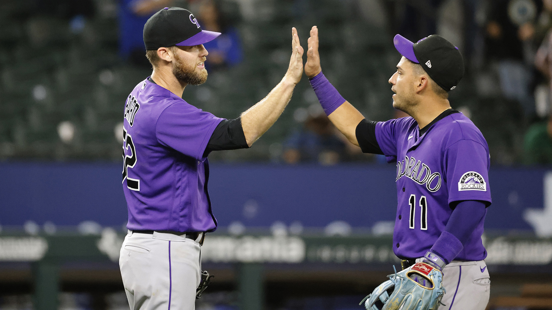 Daniel Bard and Jose Iglesias of the Colorado Rockies celebrate a 4-1 win over the Texas Rangers at Globe Life Field on April 12, 2022 in Arlington, Texas.