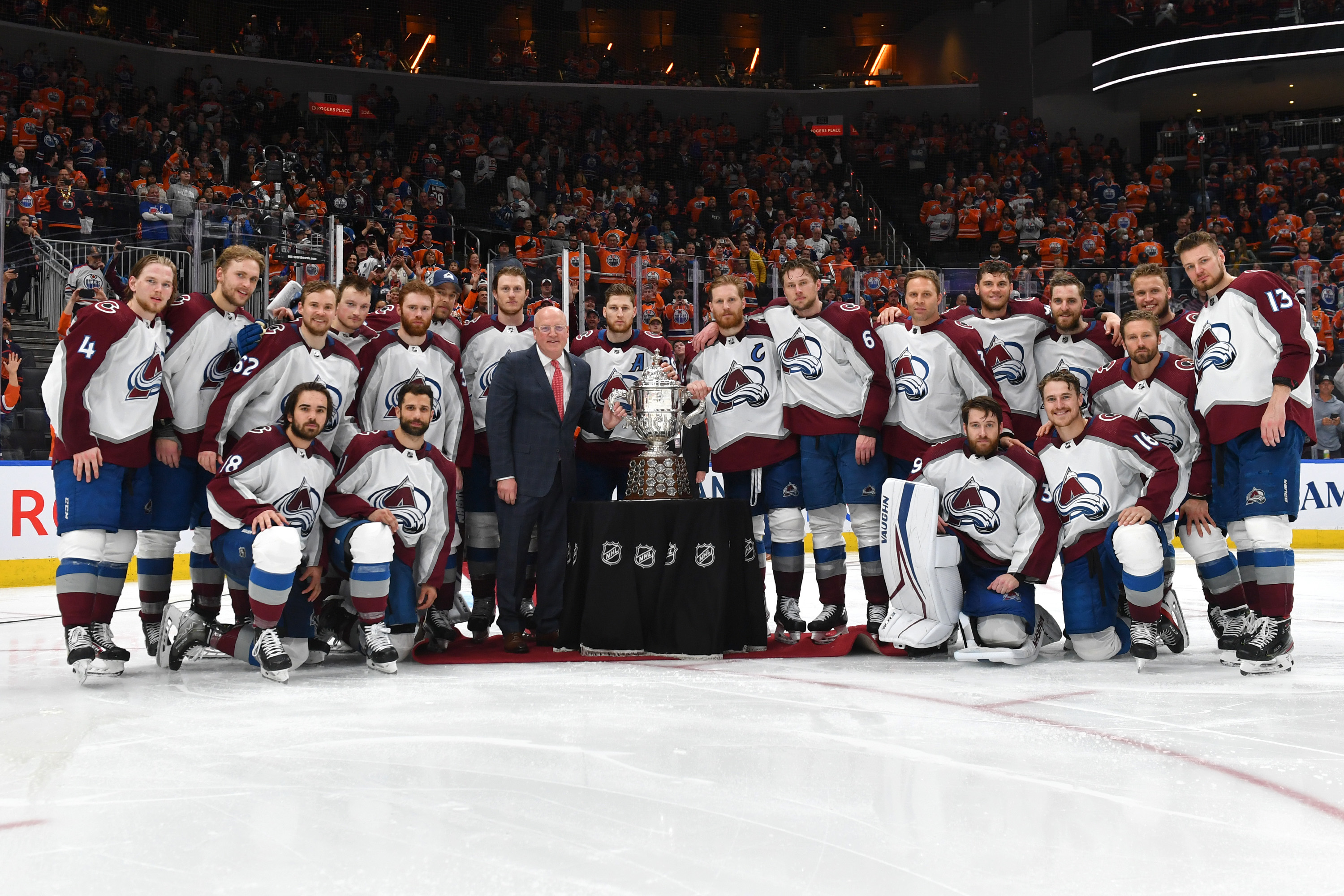 Players of the Colorado Avalanche pose with Bill Daly and the Clarence S. Campbell Bowl after winning Game Four of the Western Conference Finals of the 2022 Stanley Cup Playoffs against the Edmonton Oilers on June 6, 2022 at Rogers Place in Edmonton, Alberta, Canada.