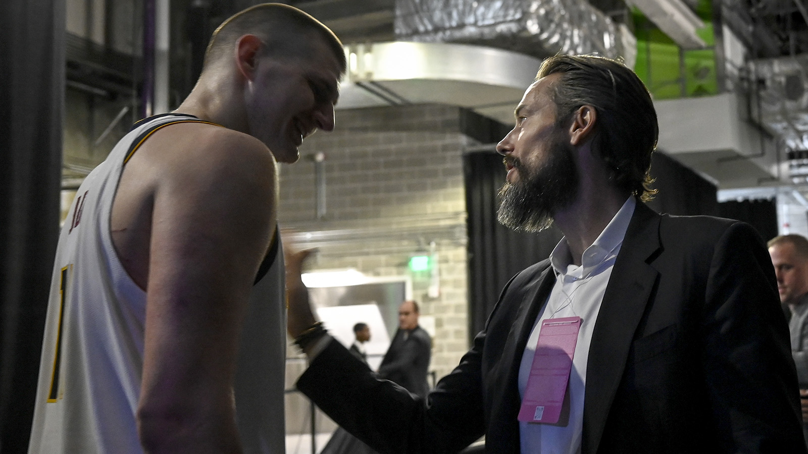 Nikola Jokic of the Denver Nuggets is greeted by Josh Kroenke at Chase Center on April 27, 2022.